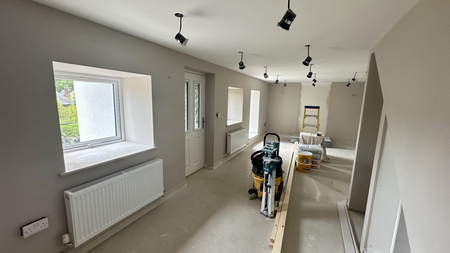 Renovated living space after plastering and decorating