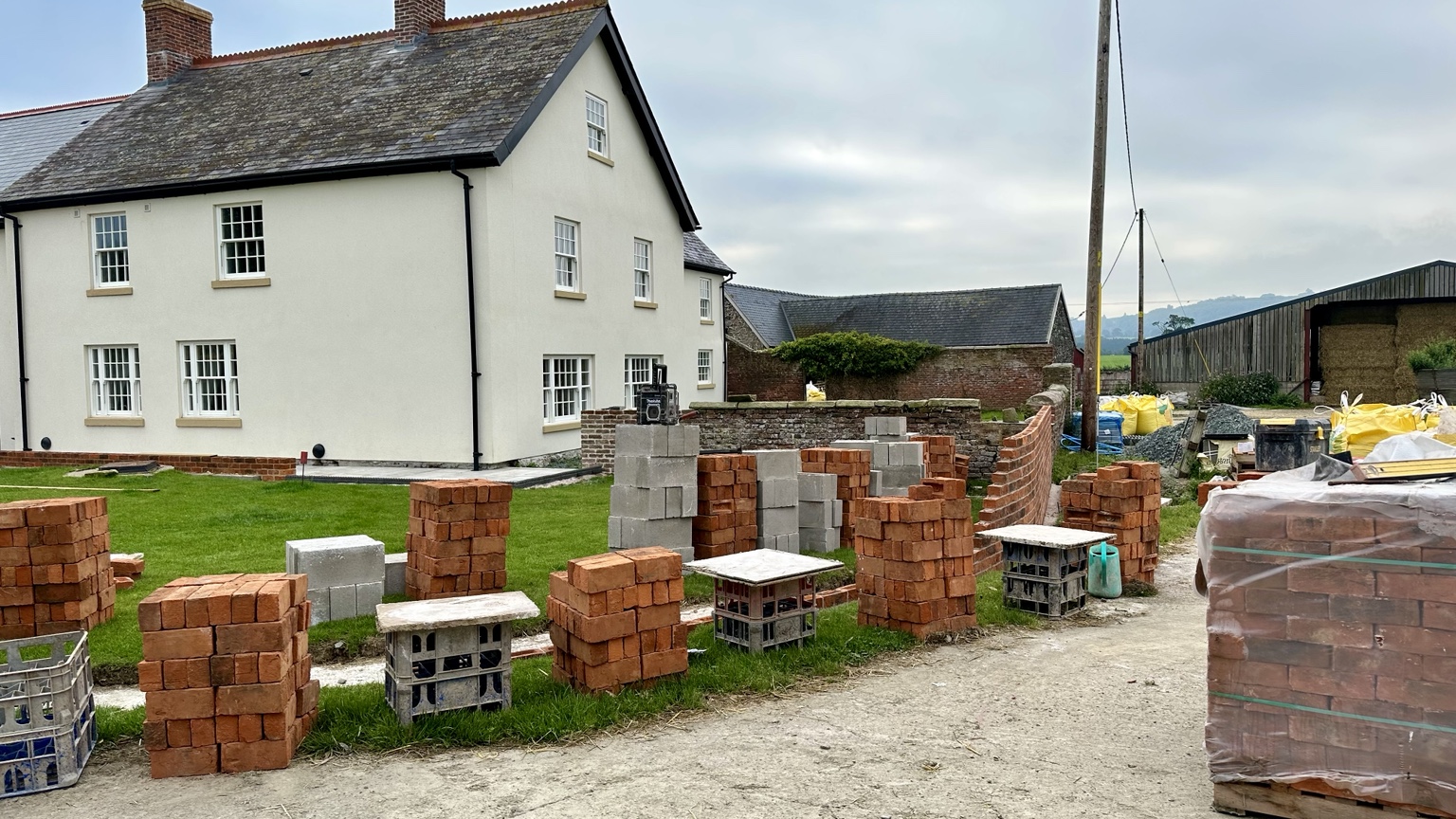 Curved brick garden wall under construction