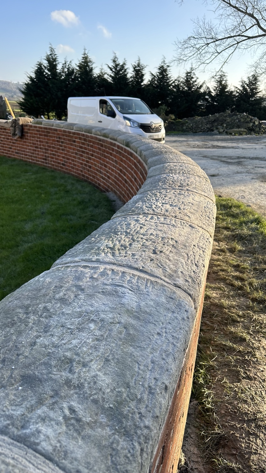 Finished curved line of stone copings