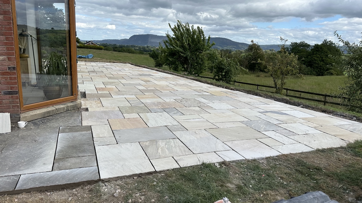 Large Indian sandstone patio with countryside views