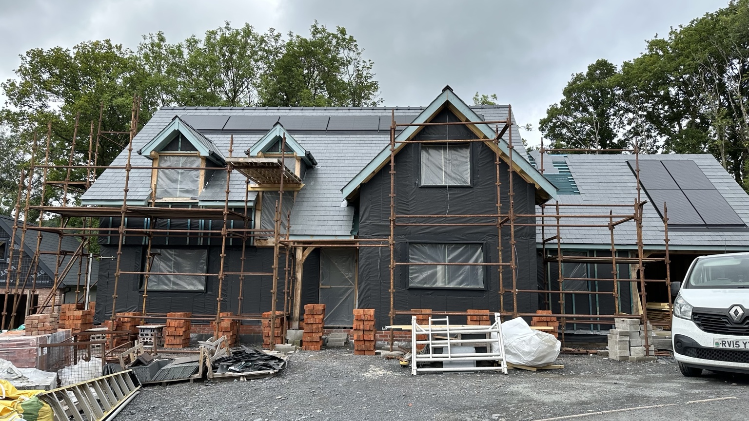 Oak frame dwelling with brickwork starting